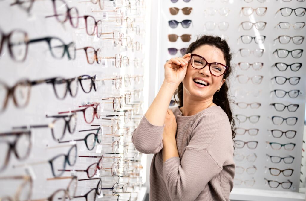 A person trying on eyeglasses at an optometry office.